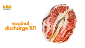 text reads "vaginal discharge 101" in orange letters. there is an illustration of a grapefruit sliced in such a way that it looks like a vulva.